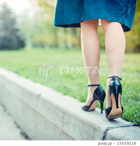 Woman is walking on a sunny day Woman is walking on a sunny day 15059216