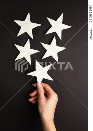 Hands holding little stars 15061696