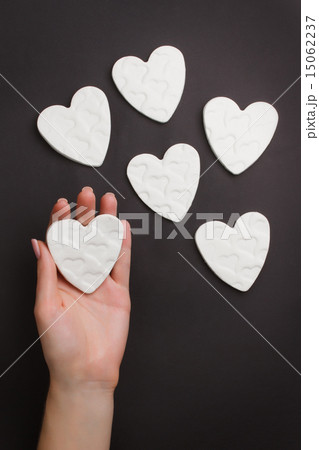 Hand holding little hearts 15062237