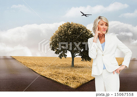 Composite image of thinking businesswoman 15067558