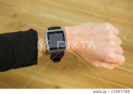 Businesswoman with smart watch on wrist 15067788