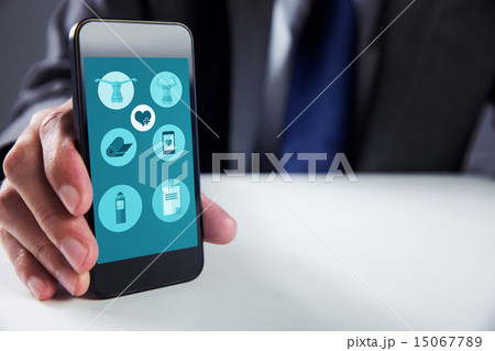 Composite image of businessman using smartphone 15067789