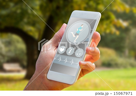 Composite image of hand holding smartphone Composite image of hand holding smartphone 15067971
