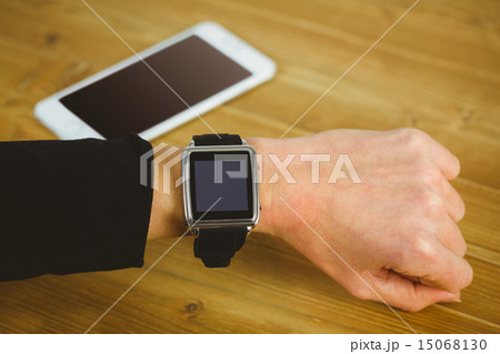 Businesswoman with smart watch on wrist 15068130
