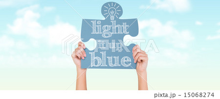 Composite image of hands showing jigsaw puzzle 15068274