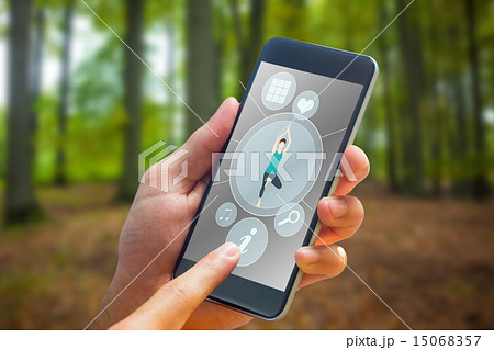 Composite image of hand holding smartphone 15068357