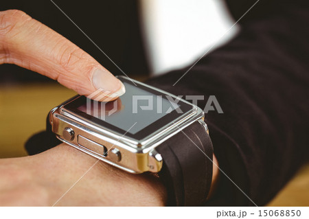 Businesswoman using her smart watch 15068850