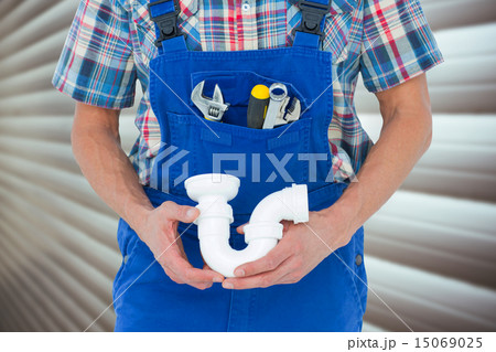 Composite image of cropped image of plumber holding sink pipe Composite image of cropped image of plumber holding sink pipe 15069025