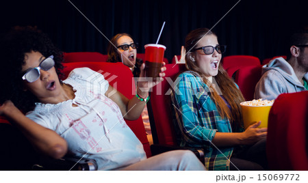 Young friends watching a 3d film Young friends watching a 3d film 15069772