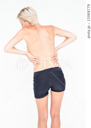 Pretty woman suffering from back pain Pretty woman suffering from back pain 15069779