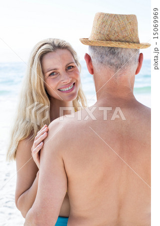 Happy couple embracing by the sea 15069969