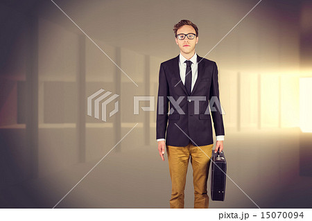 Composite image of young geeky businessman holding briefcase Composite image of young geeky businessman holding briefcase 15070094