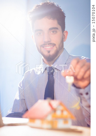 Businessman showing a key Businessman showing a key 15070104