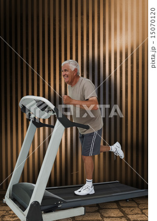 Composite image of full length of a senior man running on a trea Composite image of full length of a senior man running on a trea 15070120