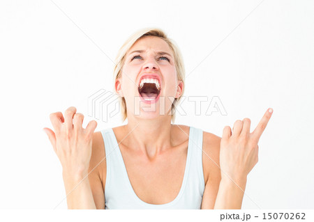 Upset woman screaming with hands up 15070262