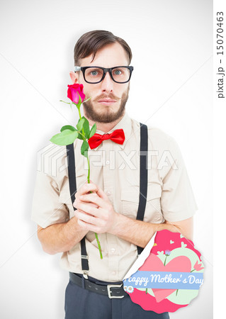 Composite image of geeky hipster offering a rose Composite image of geeky hipster offering a rose 15070463
