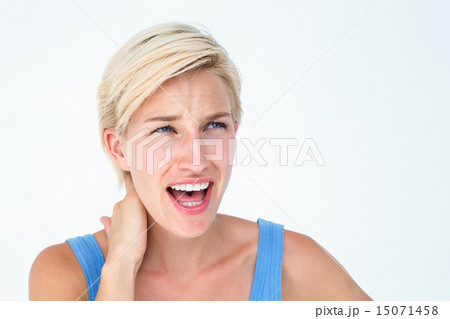 Woman screaming and suffering from neck pain Woman screaming and suffering from neck pain 15071458