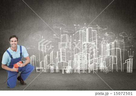 Composite image of happy carpenter holding drill machine Composite image of happy carpenter holding drill machine 15072501