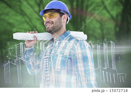 Composite image of smiling architect looking away while holding Composite image of smiling architect looking away while holding 15072718