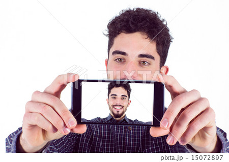 Casual man taking a selfie Casual man taking a selfie 15072897
