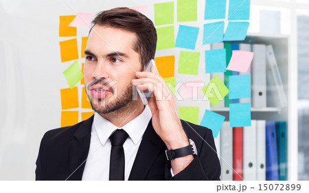 Composite image of smart businessman speaking on the phone Composite image of smart businessman speaking on the phone 15072899