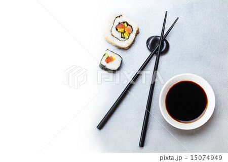 two roll, soy sauce and chopsticks 15074949