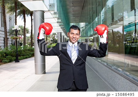 Businessman wear boxing gloves 15086495