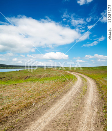 rural way under cloudy sky 15087172