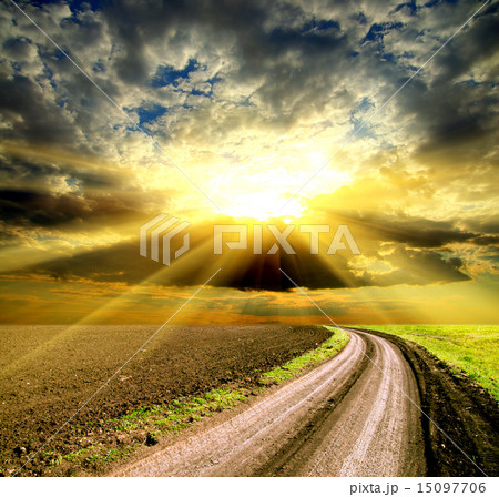 sun and clouds over field with road sun and clouds over field with road 15097706