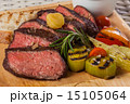 Grilled beef steak on wooden board 15105064