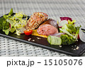 Veal sauce with vegetables on dark plate 15105076