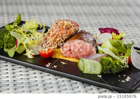 Veal sauce with vegetables on dark plate Veal sauce with vegetables on dark plate 15105076