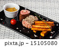 Veal sauce with vegetables on dark plate 15105080