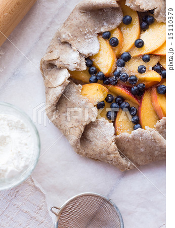cooking biscuits with peach and blueberry 15110379