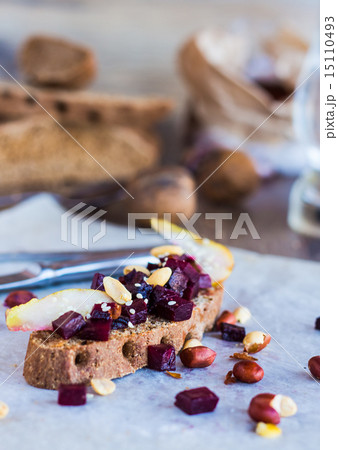 sandwich with beets, walnuts and pear black bread 15110493