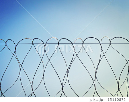 barbed wire against the sky 15110872