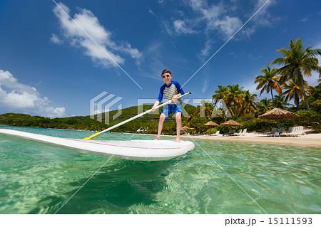 Little boy on stand up paddle board 15111593