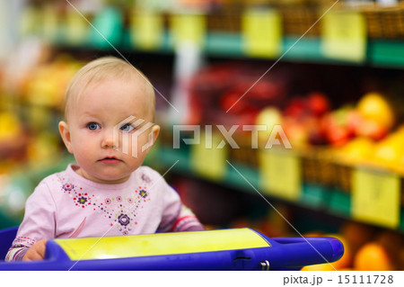 Baby girl in supermarket 15111728