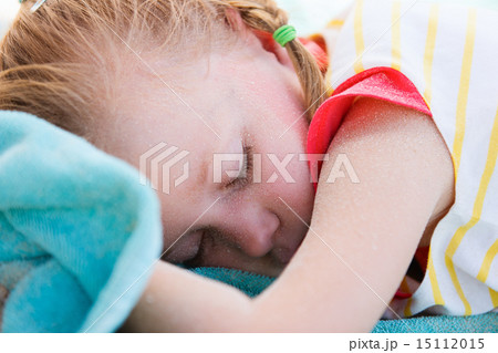 Adorable little girl at beach sleeping 15112015