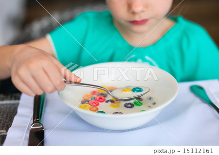 Little girl eating breakfast Little girl eating breakfast 15112161