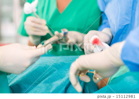 Surgeons operating in operation theater room Surgeons operating in operation theater room 15112981