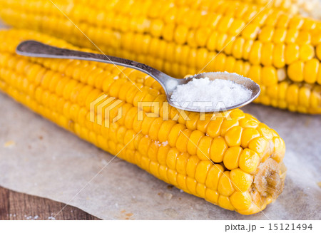 boiled yellow corn and a teaspoon of salt,close up 15121494