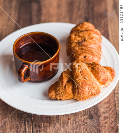 croissant with chocolate  and coffee, breakfast 15121497