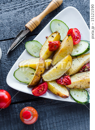 baked potato, tomatoes and cucumbers baked potato, tomatoes and cucumbers 15121590