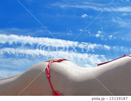 Woman sexy ass in red bikini against blue sky. 15139187
