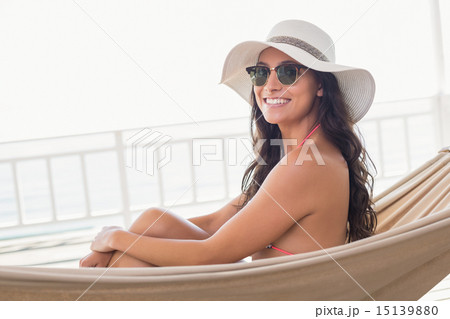 Pretty brunette relaxing on a hammock Pretty brunette relaxing on a hammock 15139880