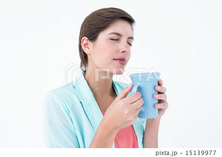 Pretty brunette drinking coffee 15139977