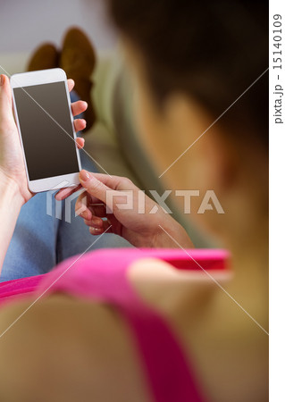 Casual woman using her smartphone Casual woman using her smartphone 15140109