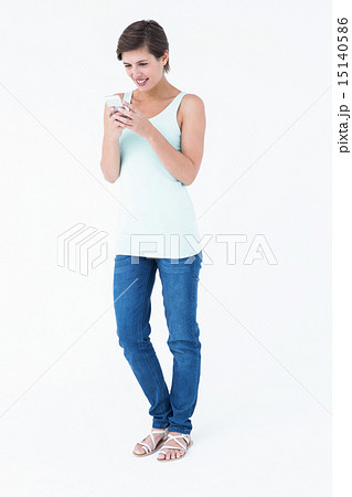 Natural woman using her smartphone Natural woman using her smartphone 15140586