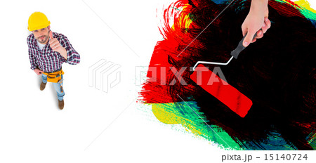 Composite image of handyman holding paint roller Composite image of handyman holding paint roller 15140724